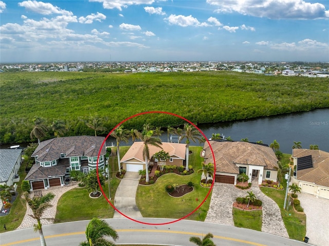 birds eye view of property with a water view