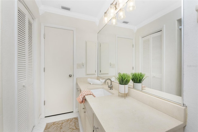 bathroom featuring tile patterned flooring, vanity, and ornamental molding