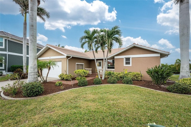 single story home with a garage and a front lawn