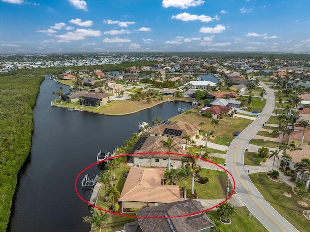 bird's eye view featuring a residential view and a water view