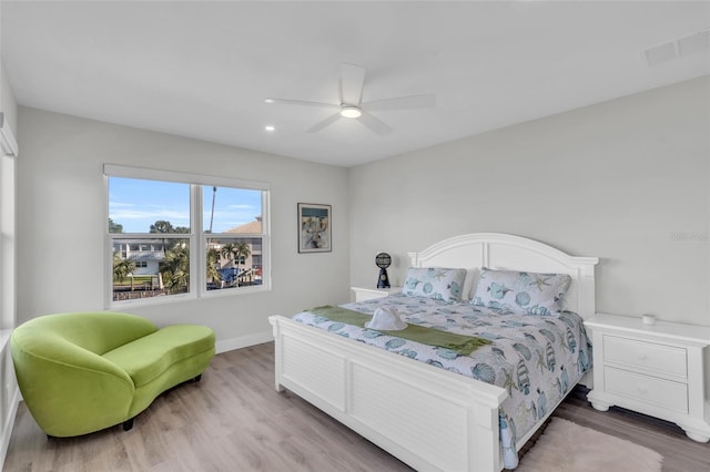 bedroom featuring hardwood / wood-style flooring and ceiling fan