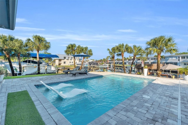 view of swimming pool featuring a patio