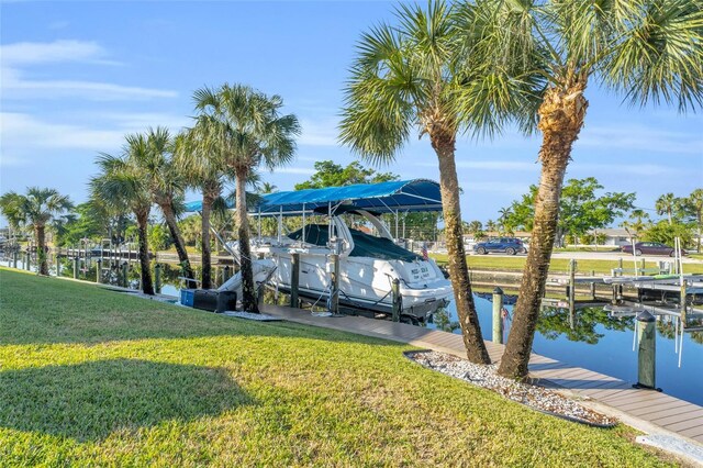 view of dock featuring a yard and a water view