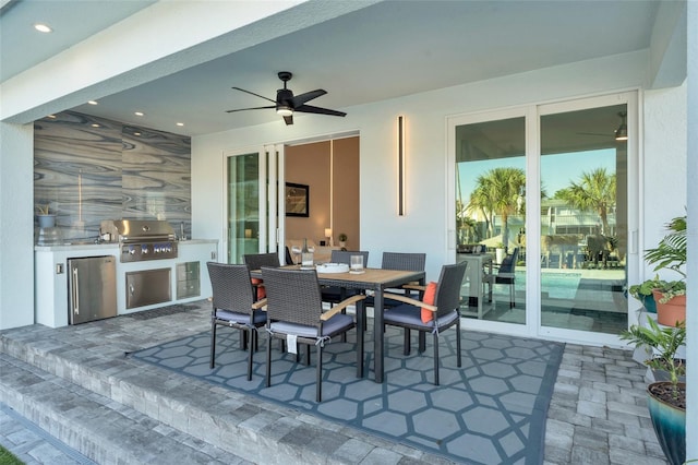 view of patio with ceiling fan and a grill