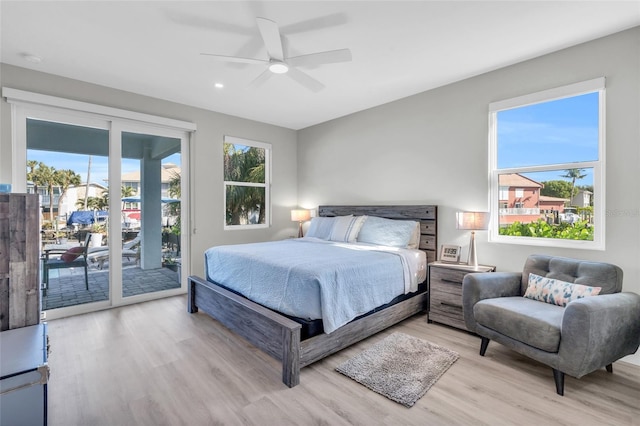 bedroom featuring ceiling fan, light wood-type flooring, and access to outside