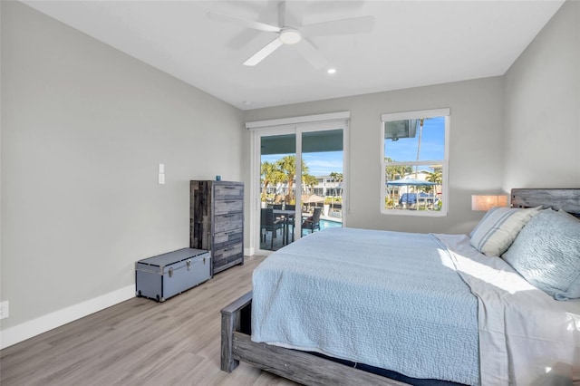 bedroom with access to exterior, ceiling fan, and light wood-type flooring