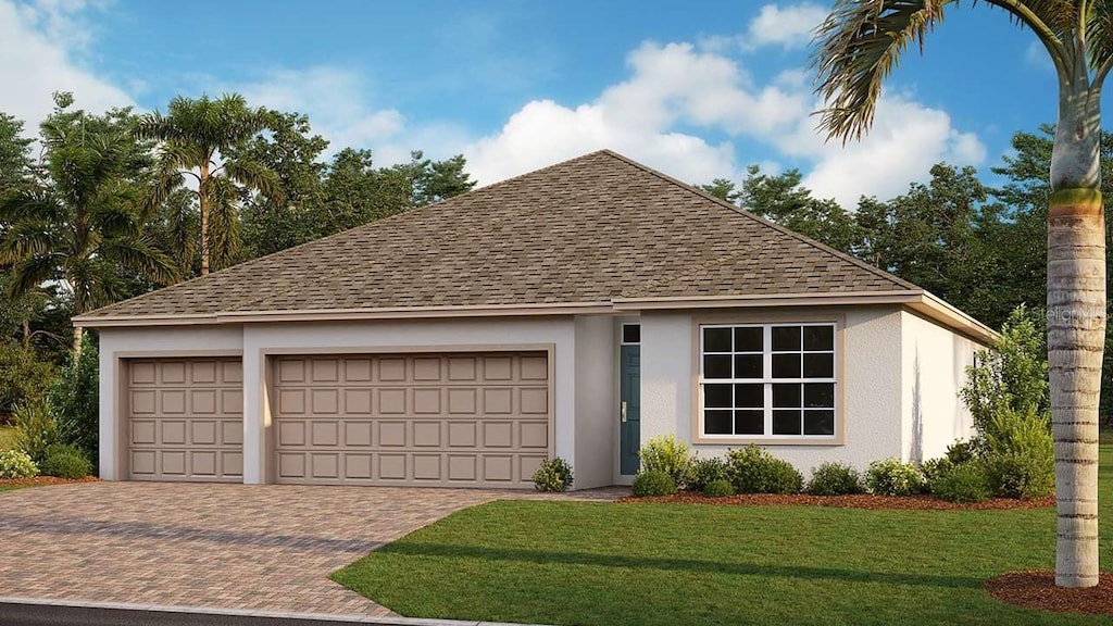 view of front of property featuring a front yard and a garage