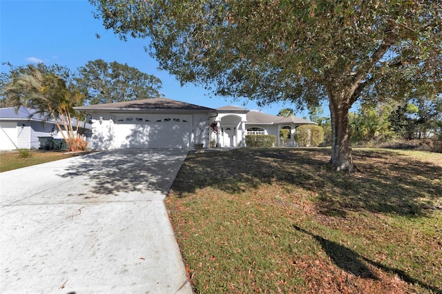 ranch-style house with a garage and a front lawn