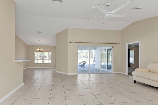 unfurnished living room with ceiling fan with notable chandelier, light tile patterned flooring, and vaulted ceiling