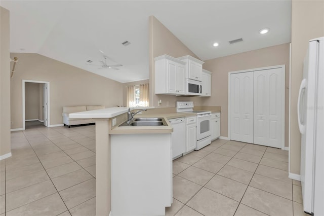 kitchen featuring kitchen peninsula, white appliances, ceiling fan, sink, and lofted ceiling