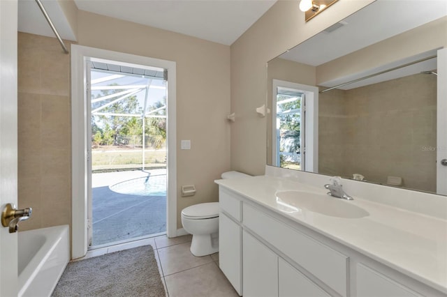 full bathroom with tile patterned floors, plenty of natural light, toilet, and vanity