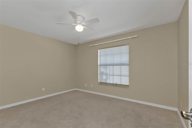 carpeted empty room with ceiling fan