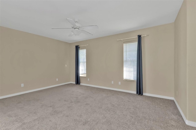 unfurnished room featuring ceiling fan and light carpet