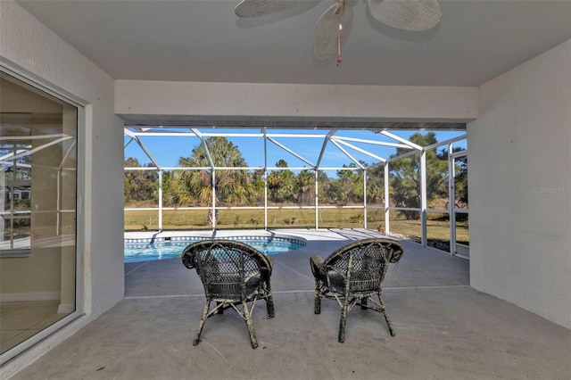 view of patio featuring glass enclosure