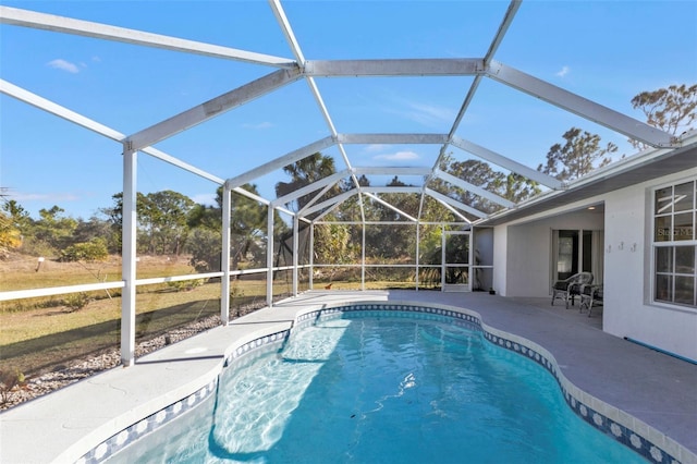 view of pool featuring a lanai and a patio area