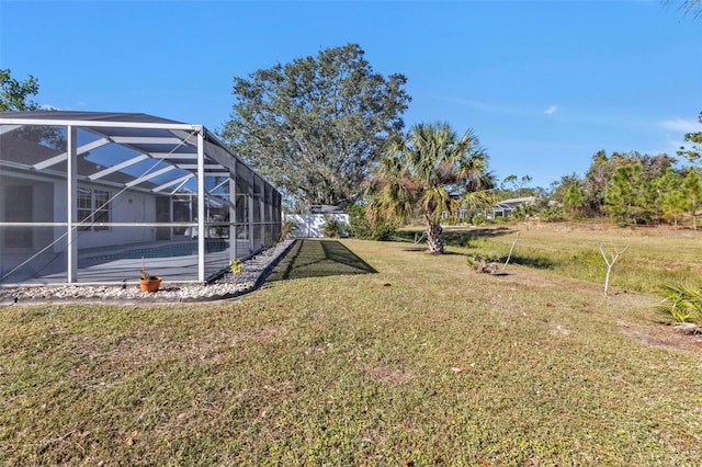 view of yard with a lanai