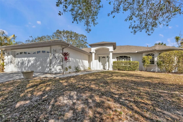 ranch-style home with a garage