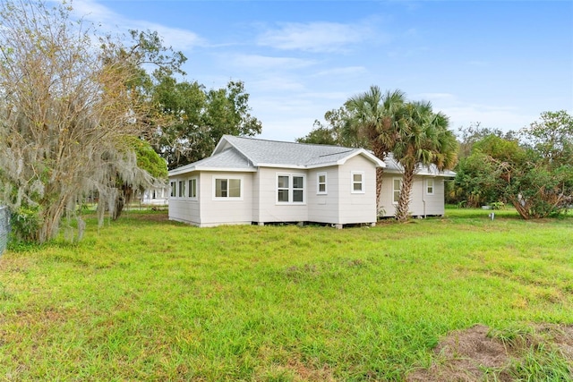 back of house with a yard