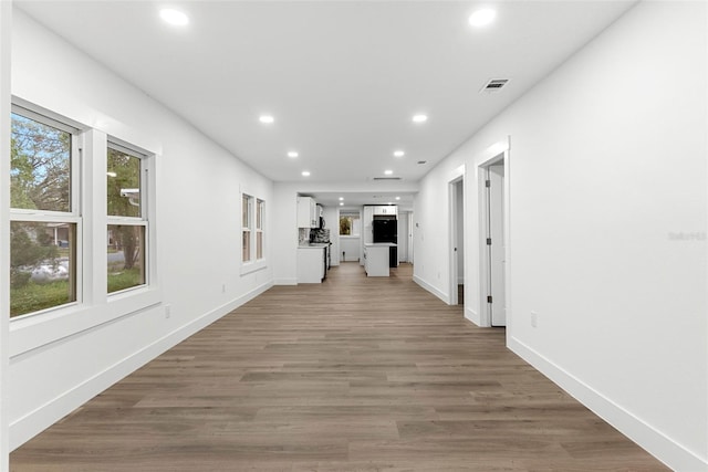 hallway featuring wood-type flooring