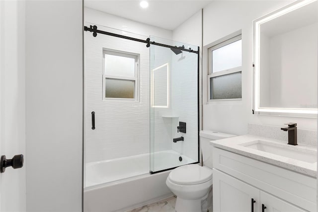 full bathroom with shower / bath combination with glass door, vanity, and toilet