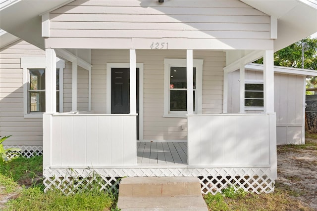 doorway to property featuring covered porch