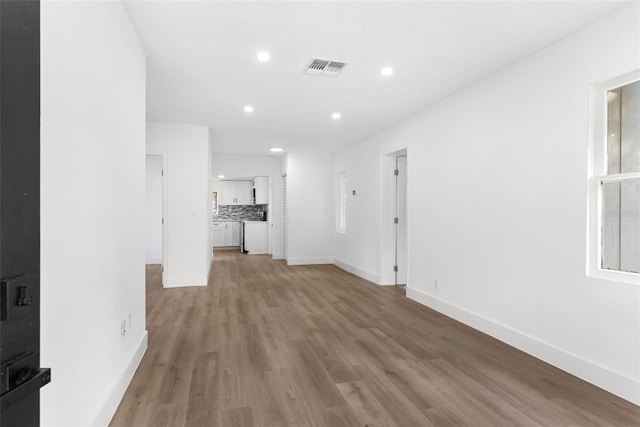 unfurnished living room with light wood-type flooring