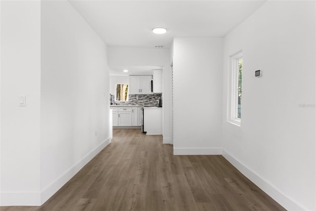 corridor featuring hardwood / wood-style floors