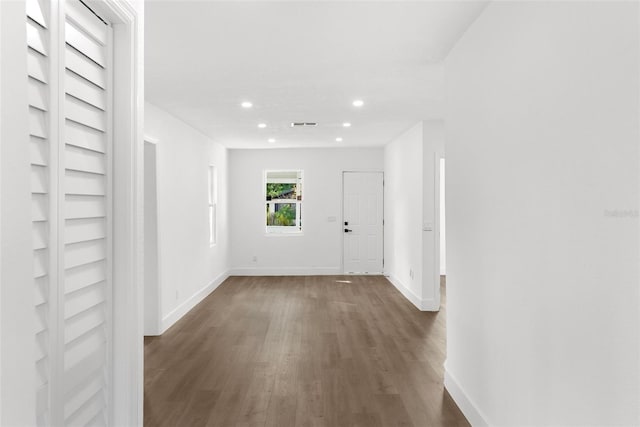 hall featuring dark wood-type flooring