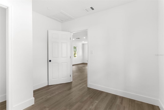 spare room featuring dark hardwood / wood-style floors