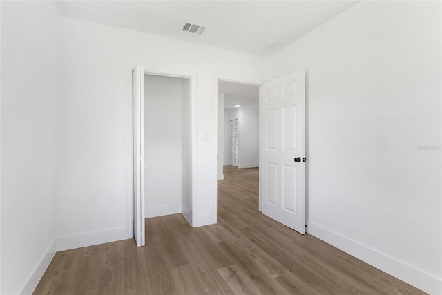 unfurnished bedroom featuring light wood-type flooring