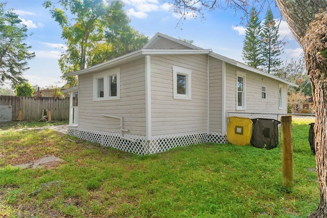 view of side of property featuring a yard