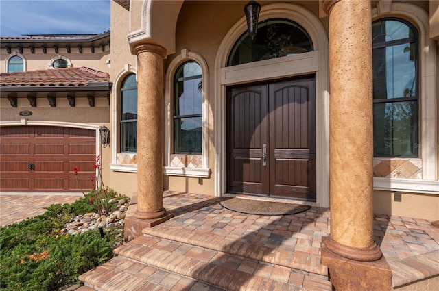 doorway to property featuring a garage