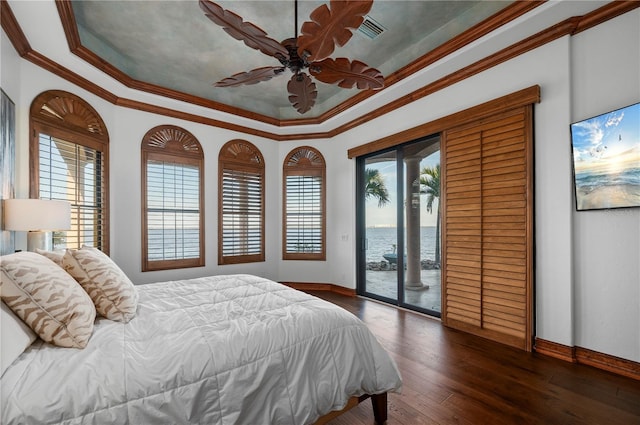 bedroom featuring ceiling fan, ornamental molding, dark wood-type flooring, and access to outside