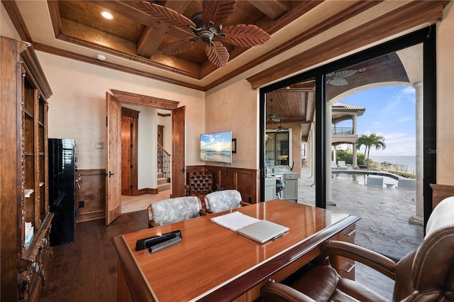 office space featuring beamed ceiling, dark hardwood / wood-style floors, and crown molding