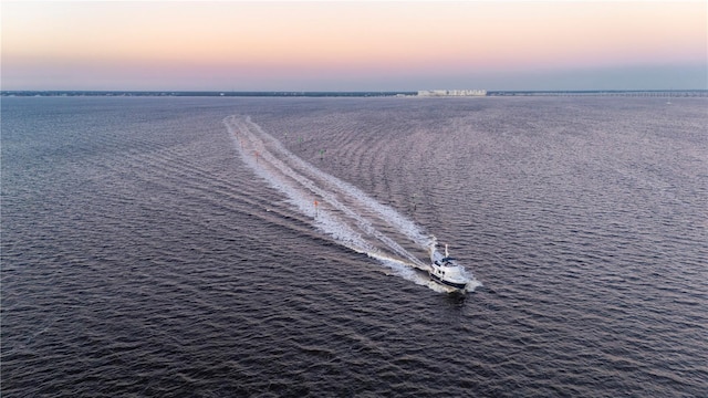 aerial view at dusk with a water view