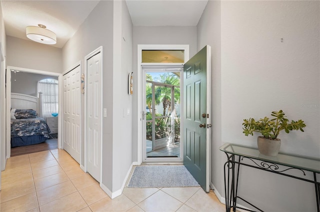 foyer featuring light tile patterned floors