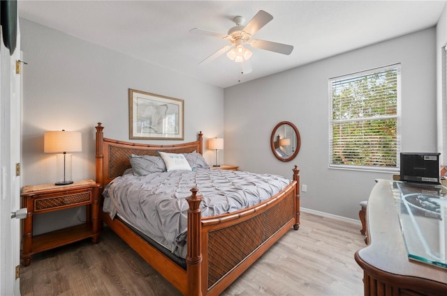 bedroom featuring hardwood / wood-style floors and ceiling fan