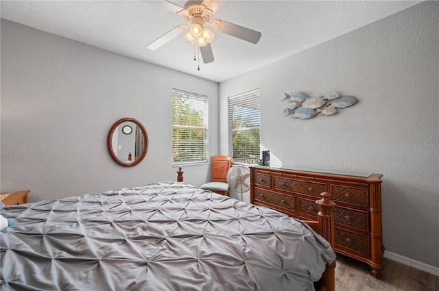 bedroom with ceiling fan and light wood-type flooring