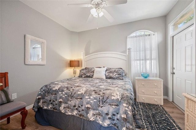 bedroom featuring hardwood / wood-style flooring and ceiling fan