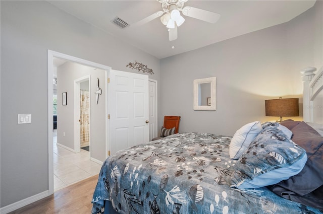 bedroom with ceiling fan and light wood-type flooring