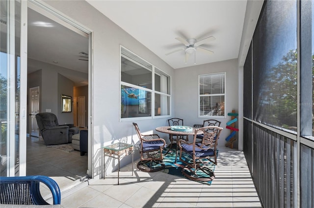 sunroom / solarium with ceiling fan