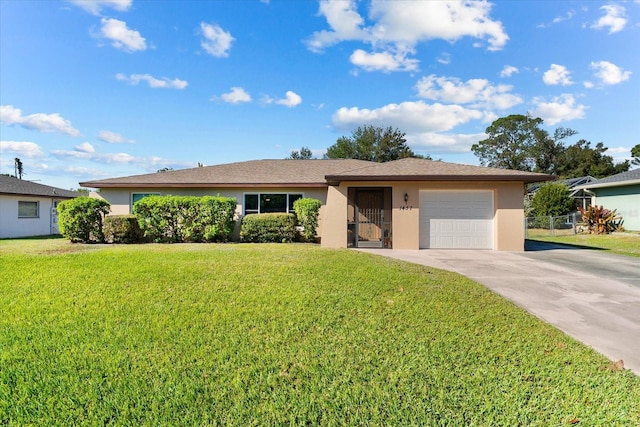 single story home featuring a front yard and a garage