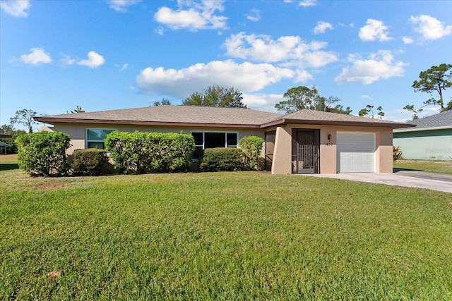 ranch-style house with a garage and a front lawn