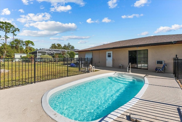 view of swimming pool featuring a lawn and a patio