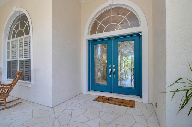 property entrance featuring french doors