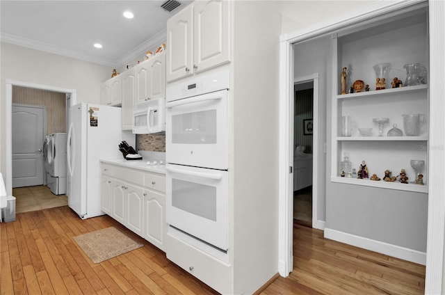 kitchen featuring white cabinetry, light wood-type flooring, white appliances, and ornamental molding