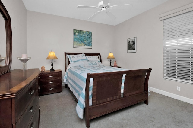 bedroom featuring light carpet and ceiling fan