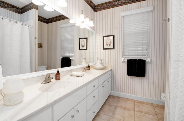 bathroom featuring toilet, vanity, and tile patterned floors