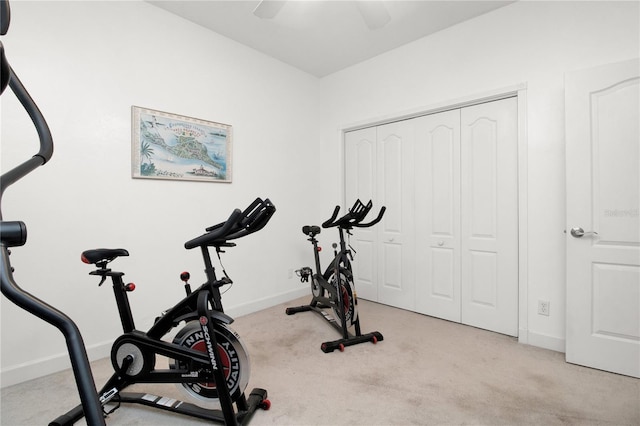 exercise room with light colored carpet