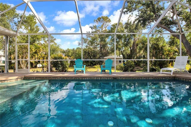 view of pool featuring a lanai